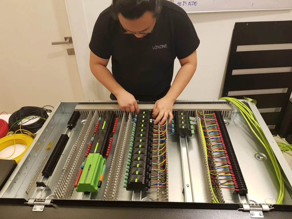 Madoc technician assembling a building automation control panel